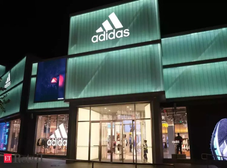 Adidas reports initial loss in three decades, cautions on US market